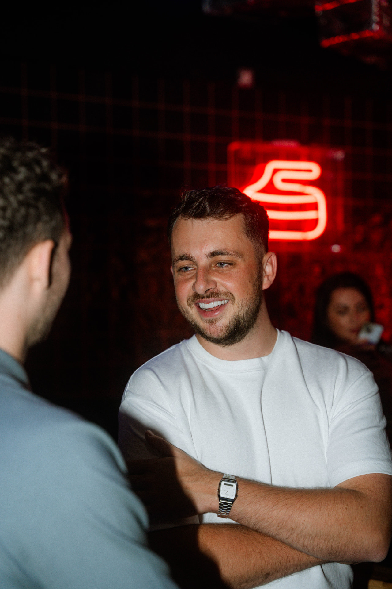 Aston Haslam, founder of The Members Club, speaking with a guest